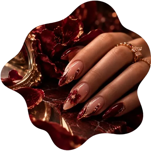 Burgundy floral manicure with gold jewelry